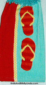pair of flip flops on hanging hand towel