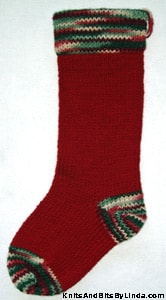 Burgundy knitted Christmas stocking with Holly & Ivy cuff, heel and toe