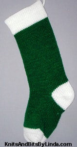 Traditional Green knitted Christmas stocking with White yarn cuff, heel and toe trim