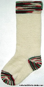 Ivory knitted Christmas stocking with Holly & Ivy cuff, heel and toe
