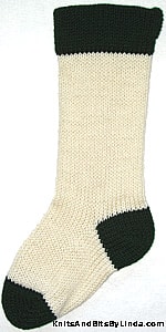 Ivory knitted Christmas stocking with Hunter Green cuff, heel and toe