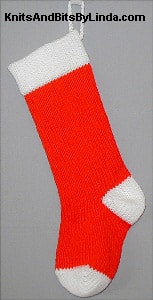 Hot Red acrylic knitted Christmas stocking with White acrylic cuff, heel and toe