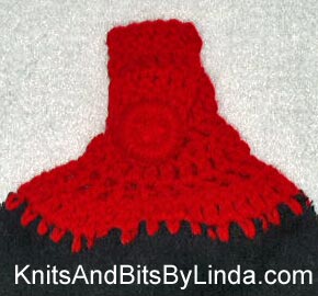 Solid black hanging hand towel with Cherry Red yarn top