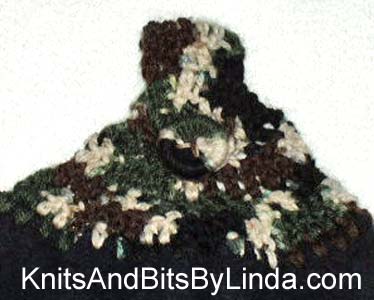 Solid black hanging hand towel with Mash yarn top