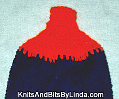 navy towel with bright orange yarn top