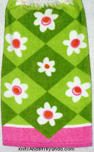 white spring flowers on hand towel
