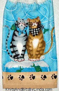 two cats on hanging kitchen hand towel