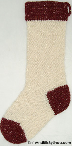 aran stocking with burgundy shiny yarn trim