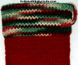 burgundy sock with holly & ivy trim