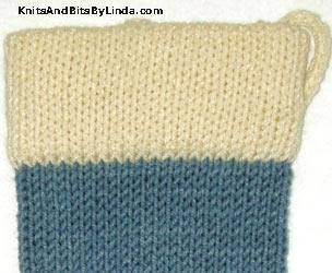 country blue stocking with ivory yarn trim
