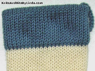 ivory stocking with country blue yarn trim