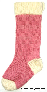 rose pink stocking with ivory yarn trim