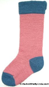 rose pink stocking with country blue yarn trim